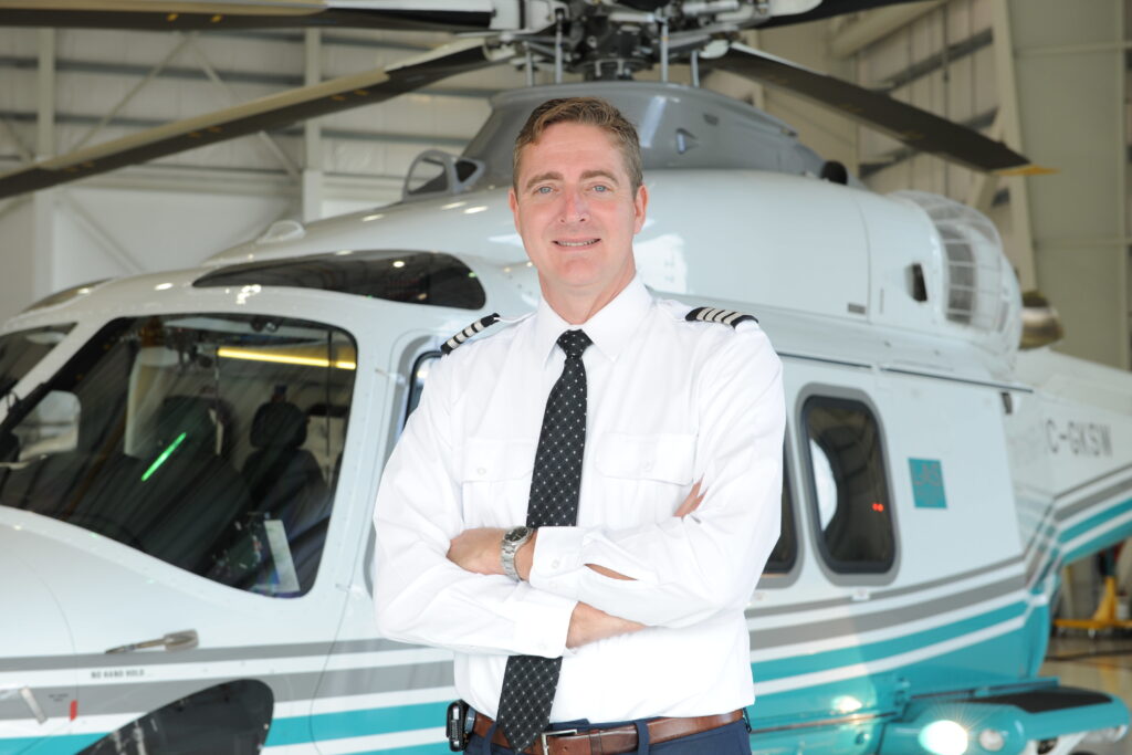 Dylan Thomas of London Air Service, standing in front of a chartered AW139 helicopter