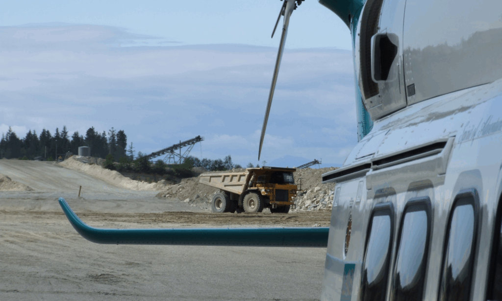London Air Services AW139  twin-engine helicopter landed at a remote construction site, supporting industrial transport and workforce mobility with safe, efficient access to rugged project locations across British Columbia.